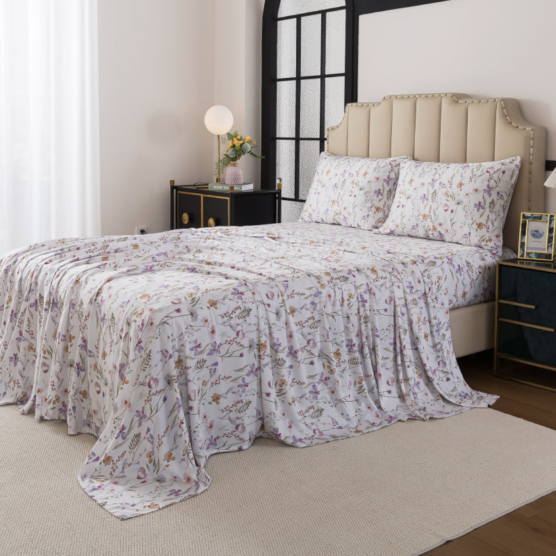 Bed with floral-patterned bedding in a bedroom setting