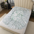 Floral-patterned mattress cover on a bed in a bedroom setting