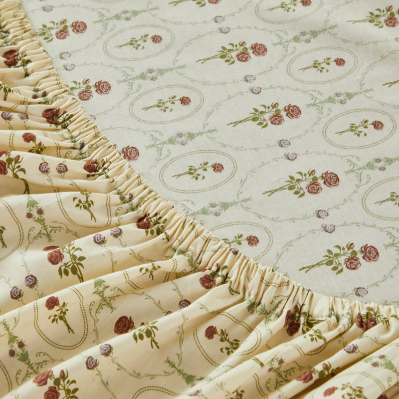 Floral-patterned mattress cover on a bed in a bedroom setting