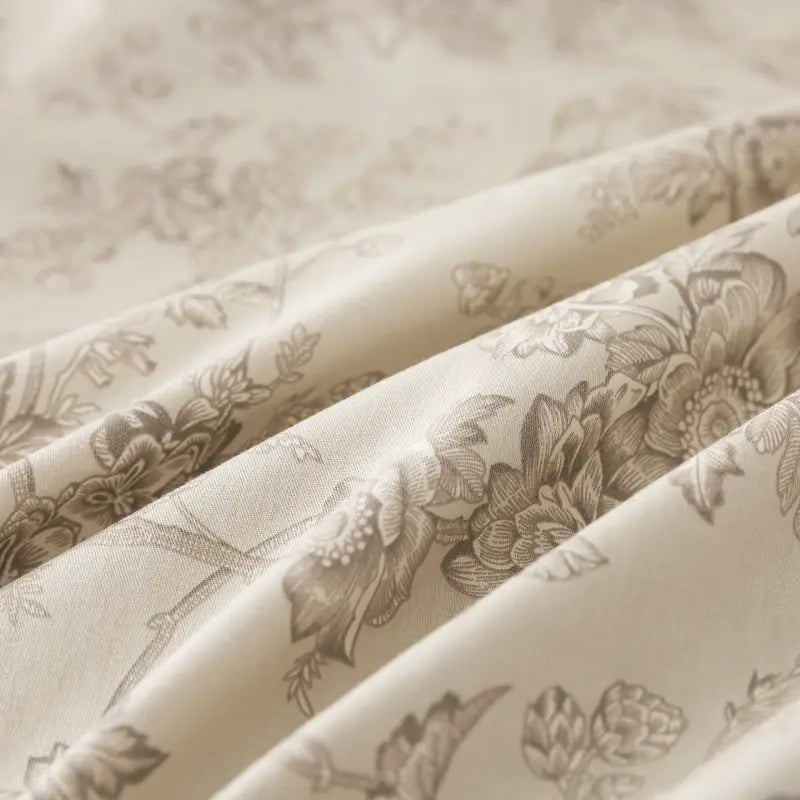 Fabric label with care instructions on a red floral patterned fabric