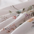 Fabric label with care instructions on a red floral patterned fabric